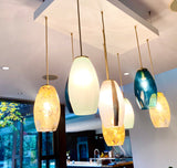 Modern pendant lights hanging in a kitchen setting