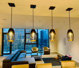 Modern living room with 4 glass grey gradient pendant lights and city view
