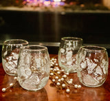 Four glasses featuring silver leaf detailing  in a classy holiday scene