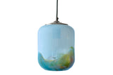 Glass pendant light turned off with a gradient of colors on a white background
