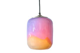 Multicolored glass pendant light at mid-level on a white background