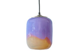 Multicolored glass pendant light, off, on a white background