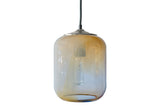 Desert sand colored glass pendant with light yellows, browns, and white turned off