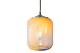 Desert sand colored glass pendant with light yellows, browns, and white in vibrant light