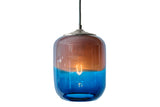 Glass pendant light with a gradient design transitioning from blue to amber with middle-level light on a white background