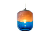 Glass pendant light with a gradient design transitioning from blue to amber on a white background with 