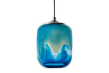 Ocean-themed glass pendant with an array of blues and white, illuminated by mid-level light