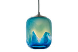 Ocean-themed glass pendant with an array of blues, greens, and white, illuminated by full and beautiful lights