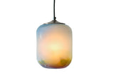 Sunset glass pendant with a gradient of blues and yellows and splashes of green and red on the rim, fully illuminated on a white background
