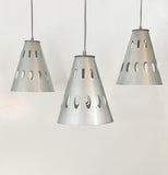 A modern perforated steel pendant light with a brushed silver-color finish, featuring a geometric design and a color cord selection