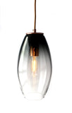 Hand-blown, mold-formed glass pendant with a grey fade color and a polished copper finish, featuring a copper cord.