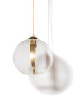 A  sphere glass pendant light with a gold leaf detailing in the middle, hanging from a goldmetal chain in bright lighting on a soft white background
