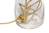 A cylinder lamp base made out of clear glass with gold cording inside and out on a white background