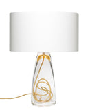 A clear glass bottom, gold cording, and a white shade top lamp on a white background.