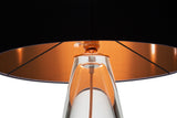 A close-up of the top of a modern black top lamp, copper cord, and glass bottom