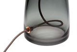 Copper cord details inside and outside a grey glass lamp base on a white background.