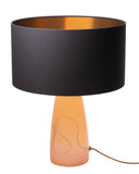 A table lamp with a rose quartz glass base and a charcoal-colored shade with a copper interior, complemented by a black linen shade.