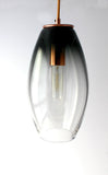 A oval-shape clear to black glass light centerpiece for the bedroom, kitchen, offices, and more.