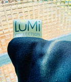 A Lumji Collection tectile label for the Onda velvet pillow