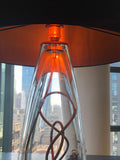 A close-up of the warm orange light the Lumi collection SERAFINA lamp creates